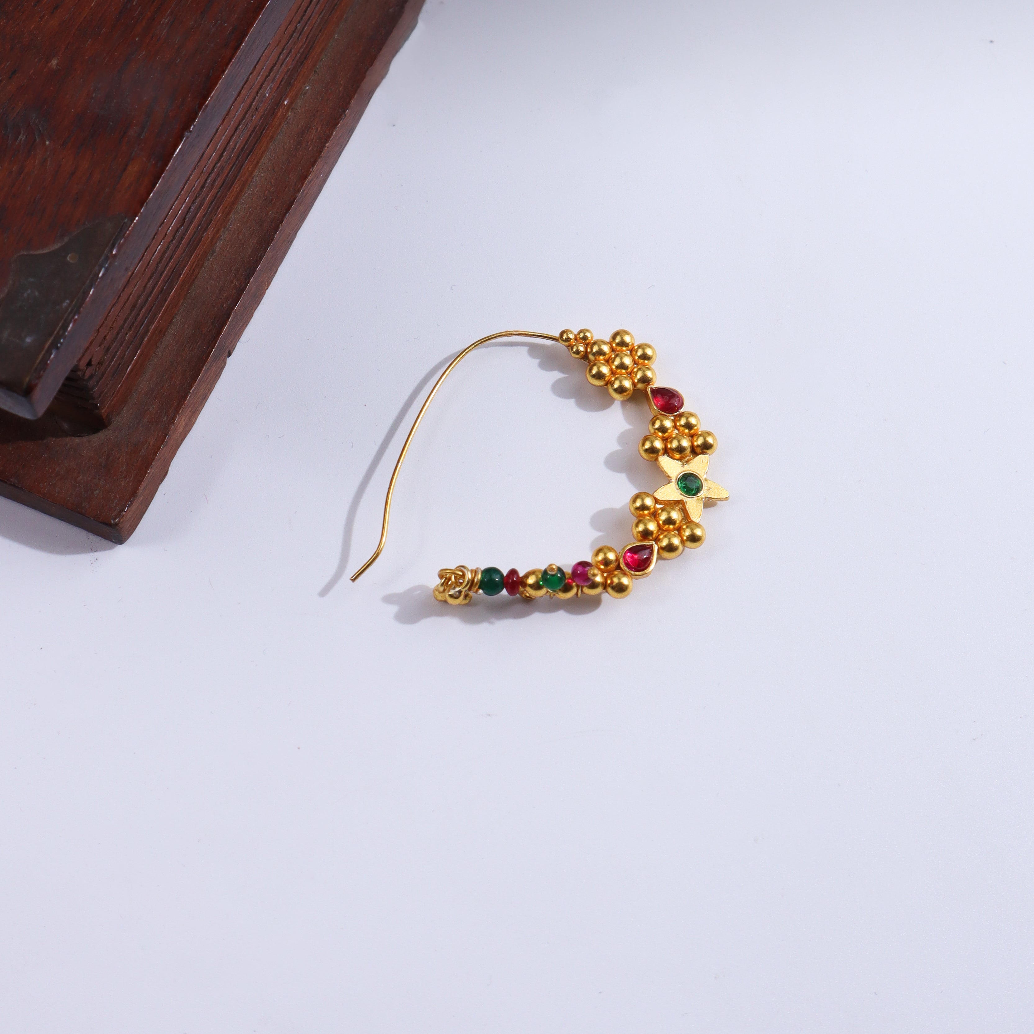 Gold and red gemstone nath