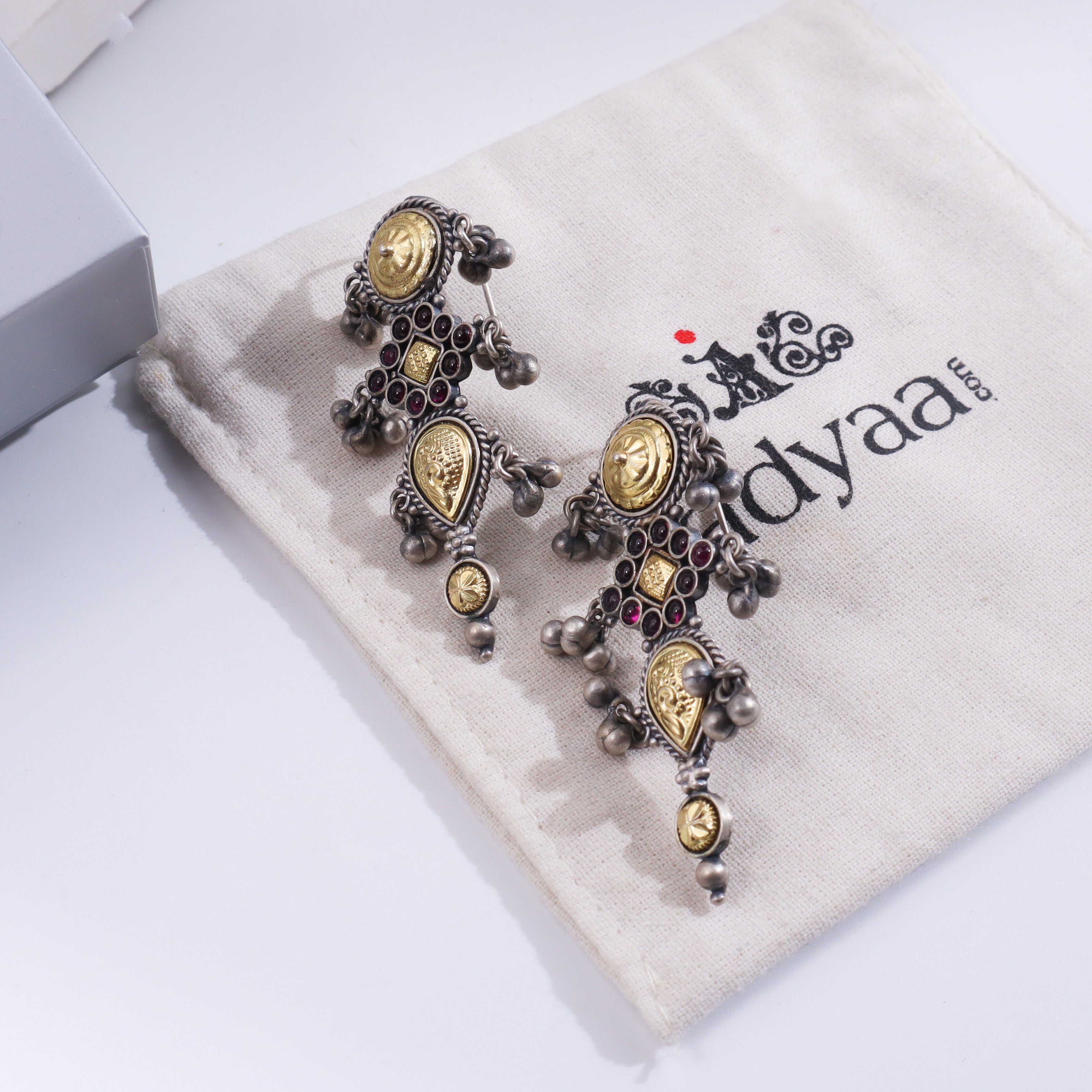 Silver Revival Rajasthani Pupat Earrings with intricate design and gold accents