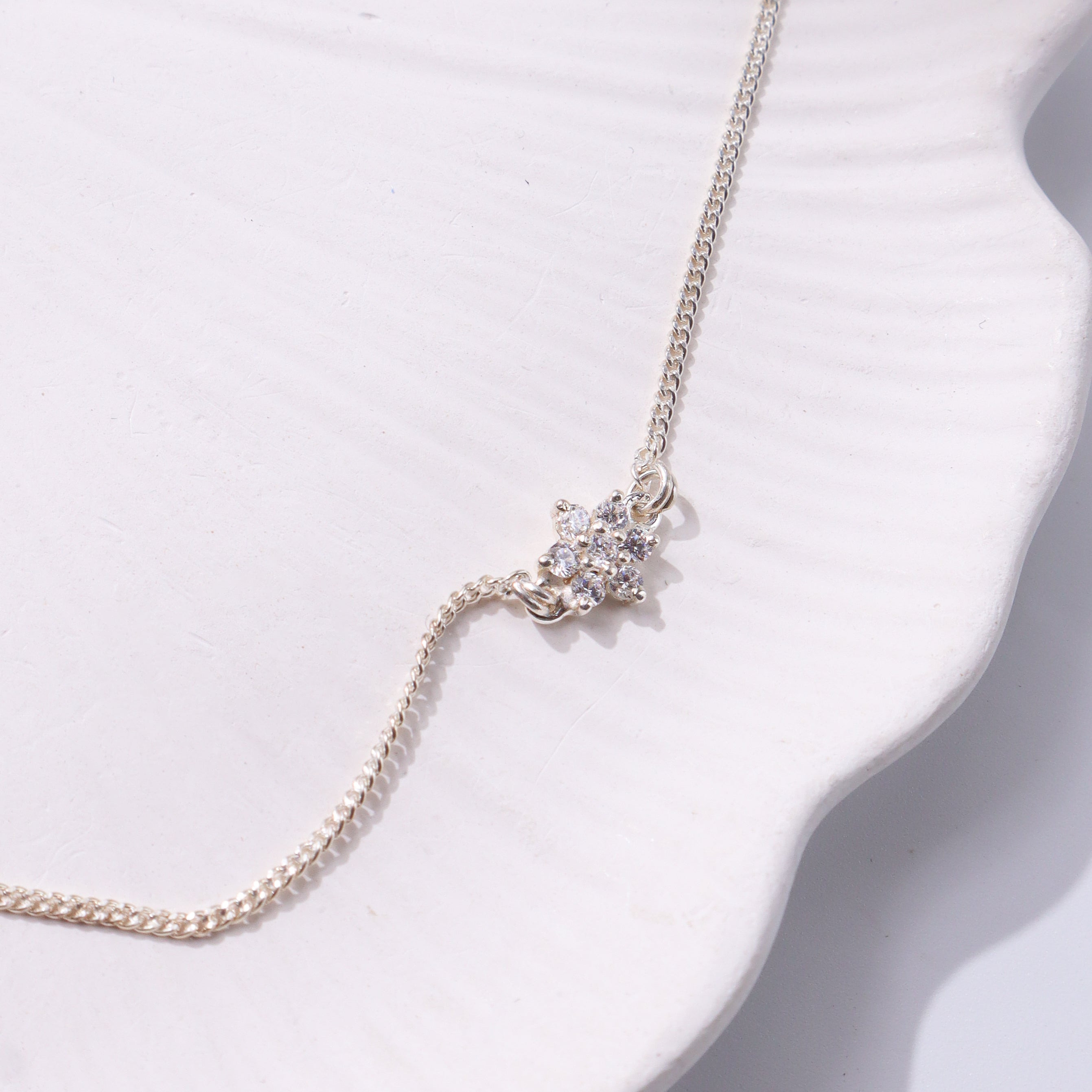Silver chain with floral pendant and CZ stones