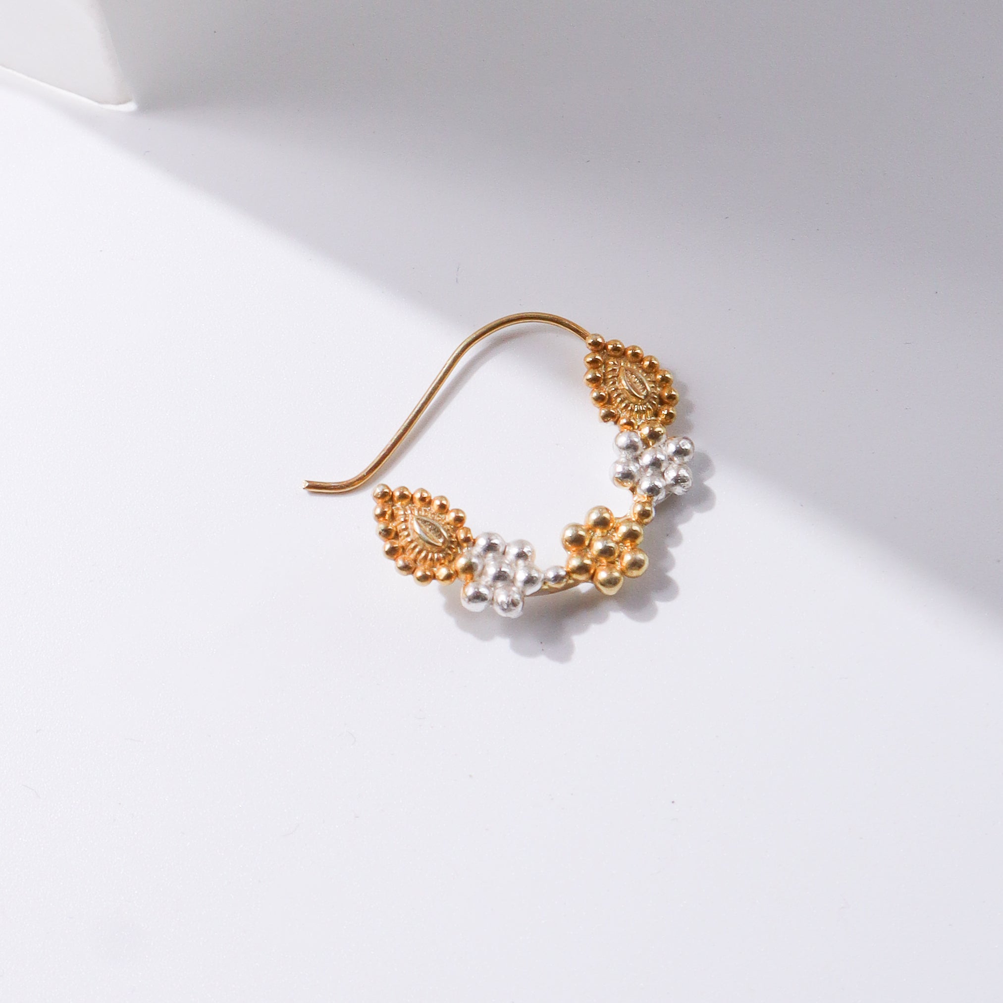 Gold and silver earrings with intricate design for traditional wear