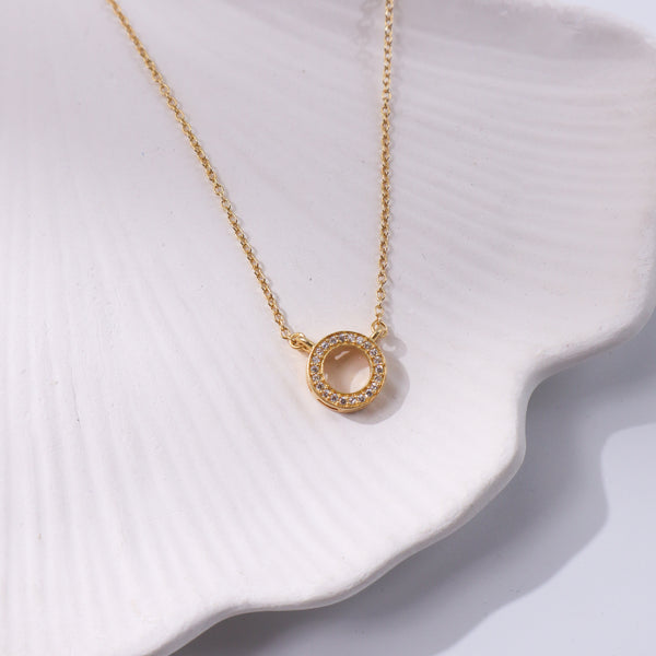 Gold circle CZ pendant necklace with sparkling stones