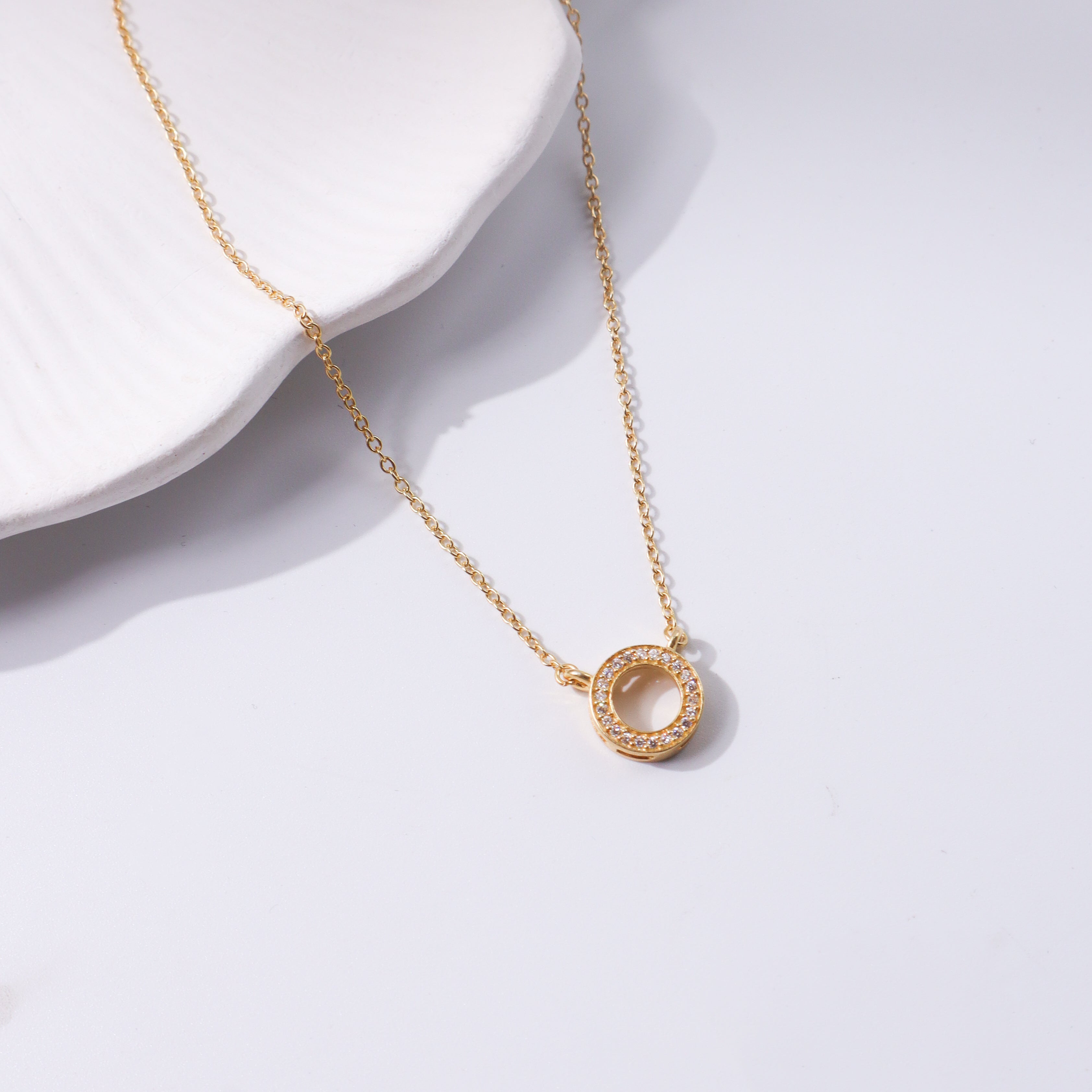 Gold circle CZ pendant necklace with silver chain
