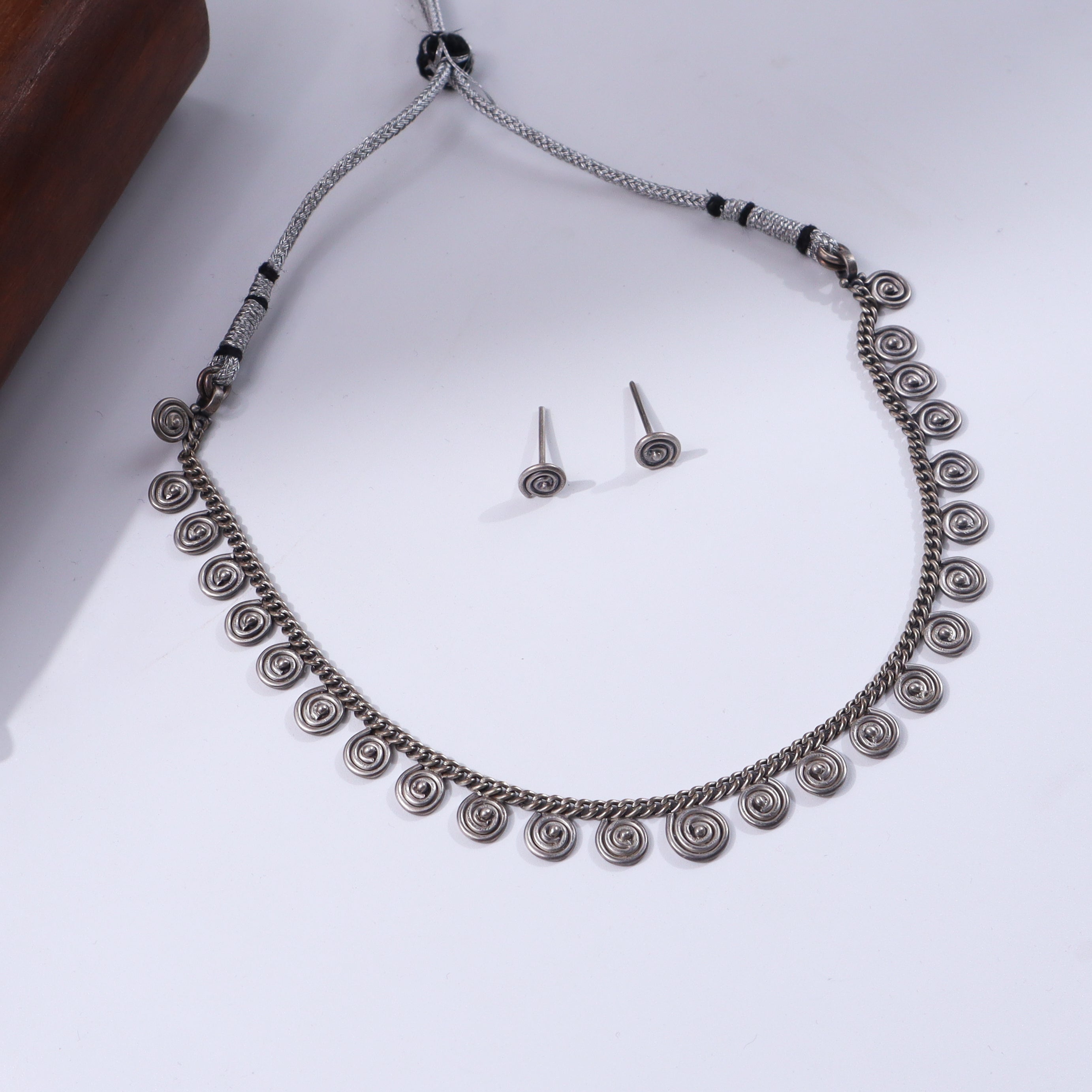Silver spiral jewelry set with matching earrings