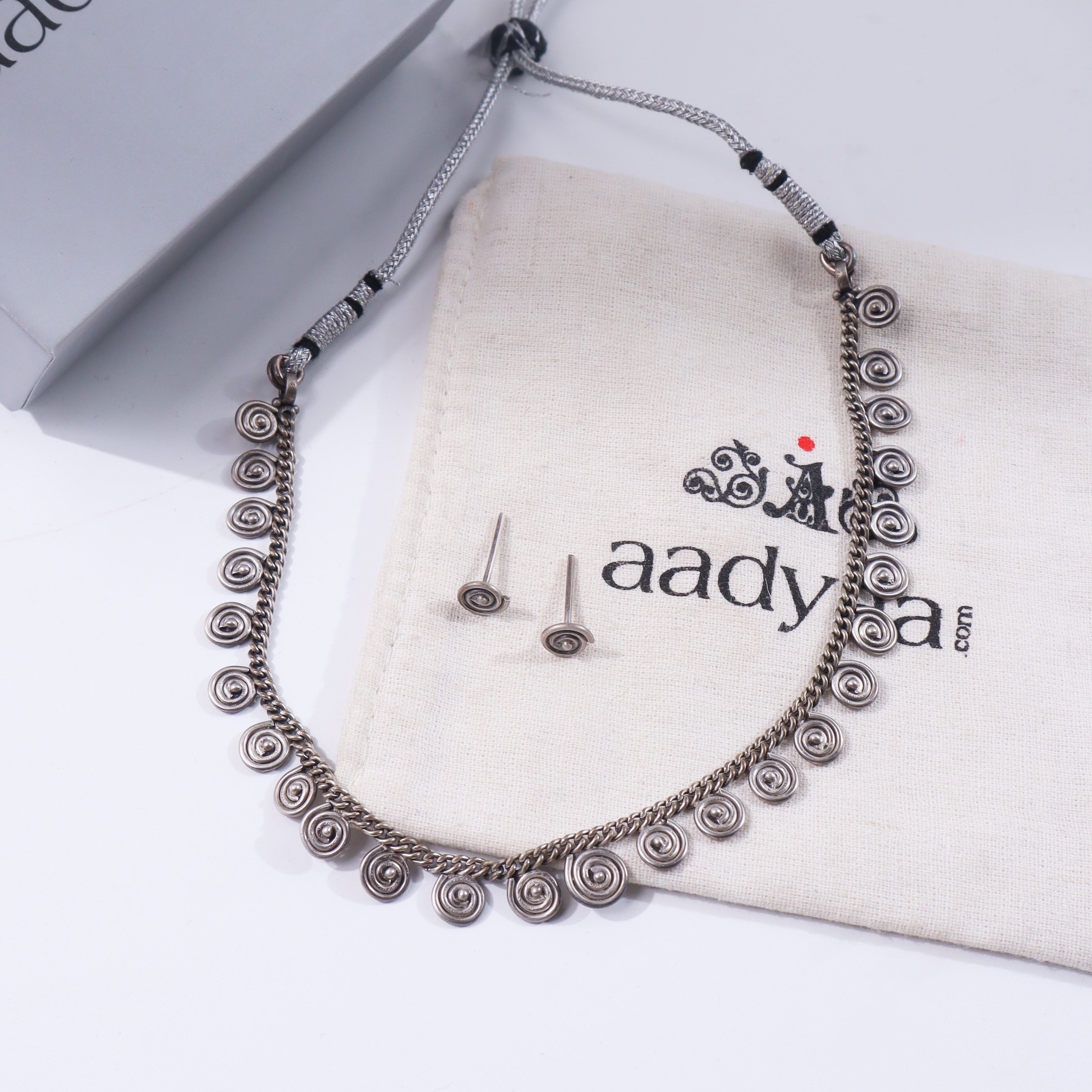 Silver spiral jewelry set with oxidized finish