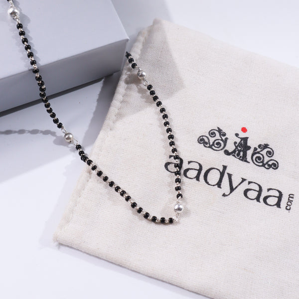 Sterling silver beaded mangalsutra on white fabric and box