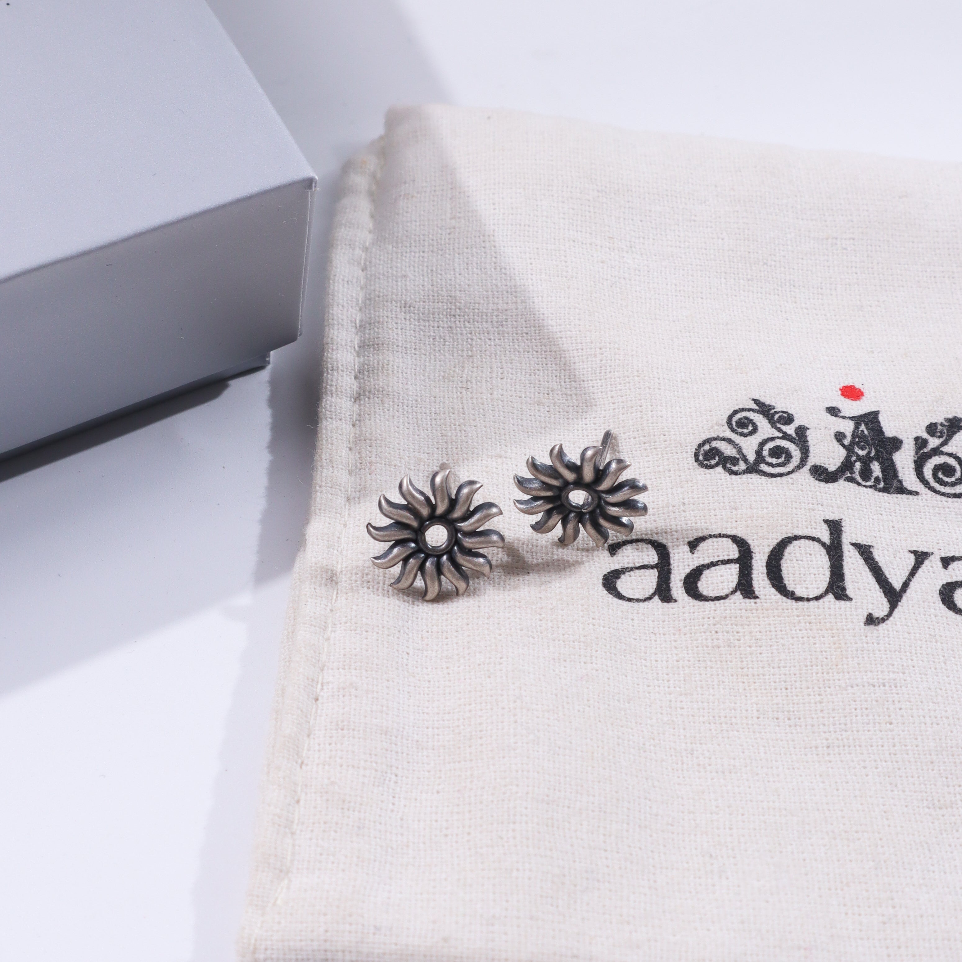Silver Sun Motif Studs earrings with handcrafted silver design