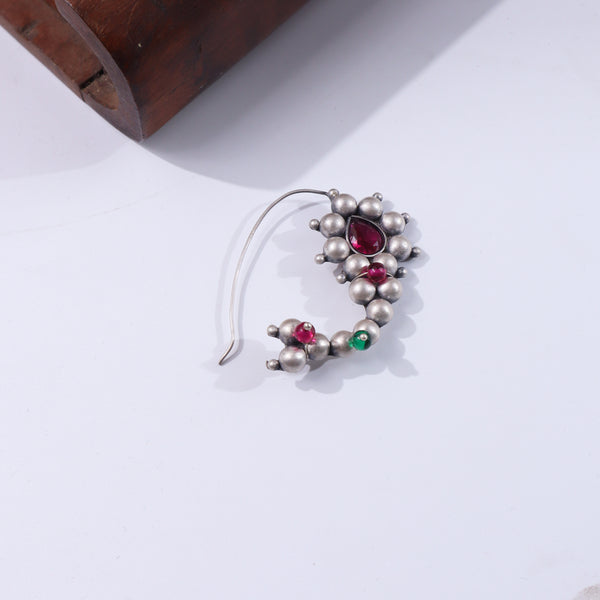 Silver jewelry with pink and green stones