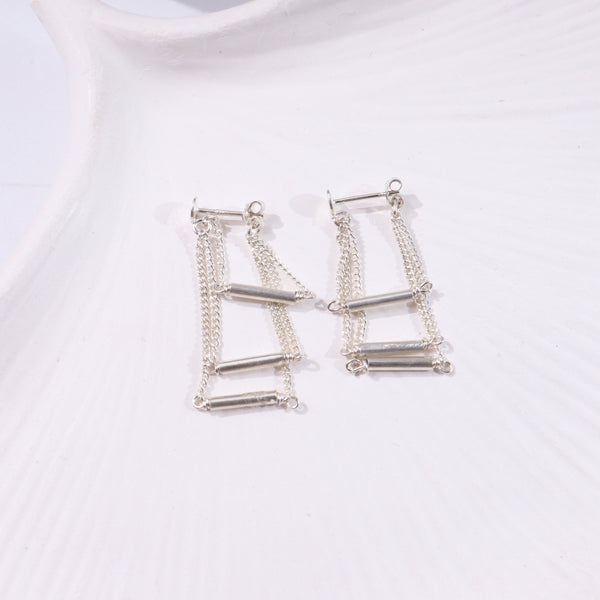 Silver layered chain earrings with cylindrical bars and dangling chains
