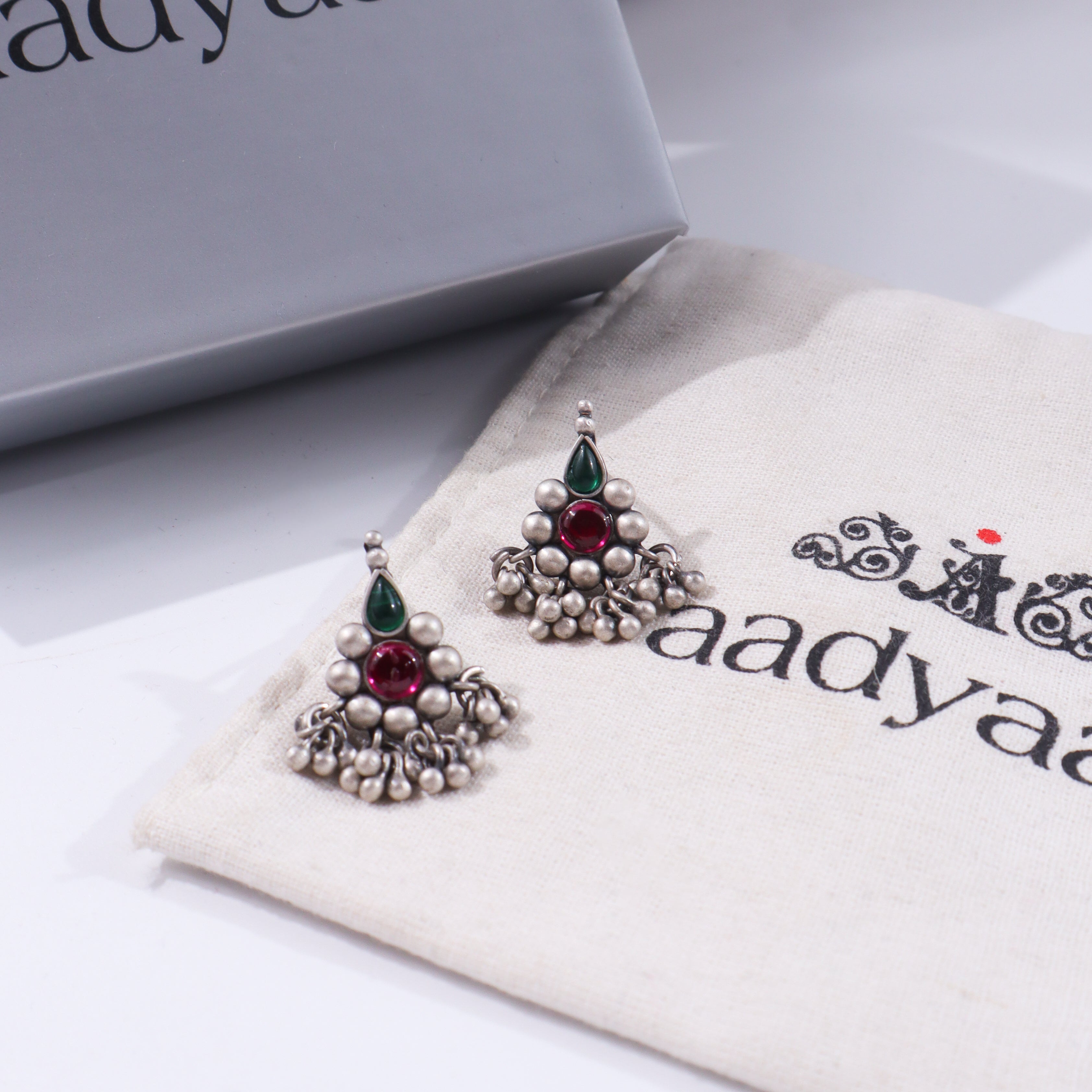 Silver traditional earrings with colorful stones