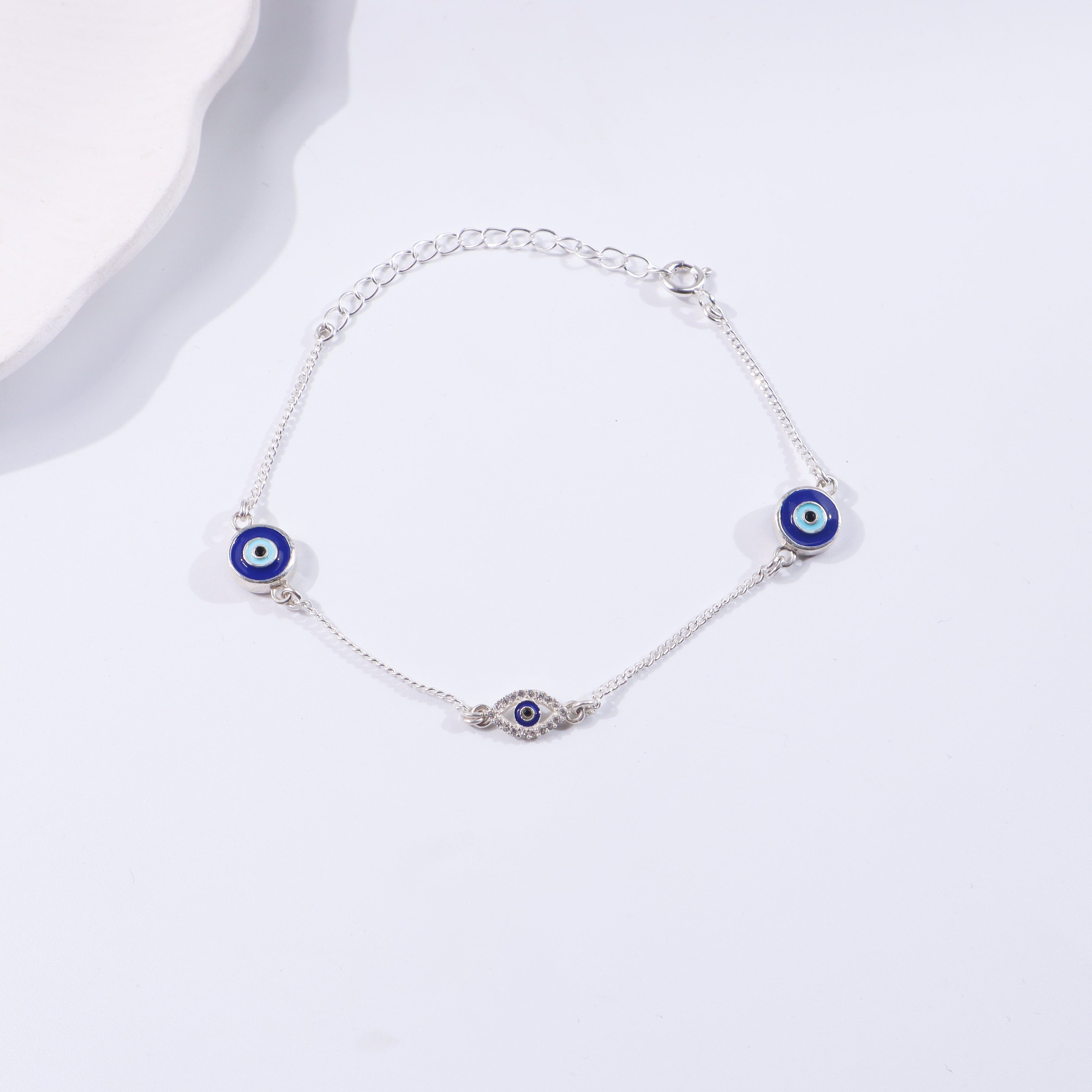 Silver bracelet with evil eye charms