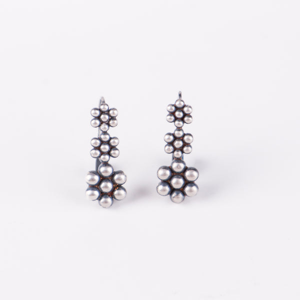 Angled side view of Kudi Dangling Earring in sterling silver