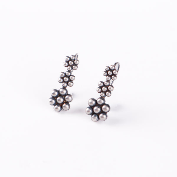 Detail shot of Kudi motif and polished silver finish