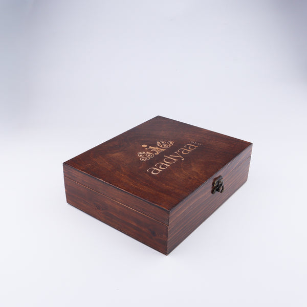 Closed wooden jewelry box with logo