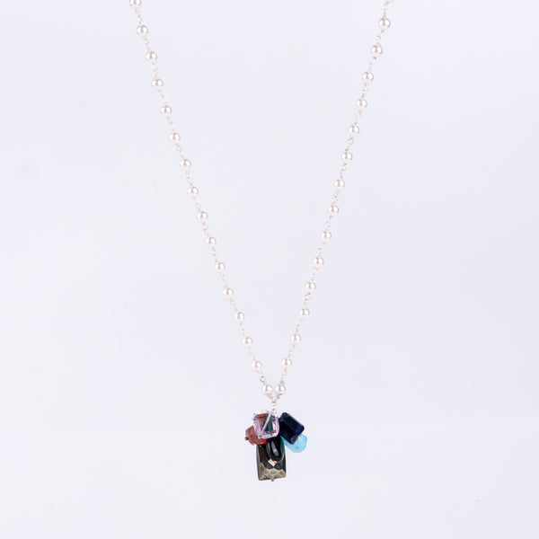 Angled side view of multicolour gemstone necklace showing layered design and silver craftsmanship