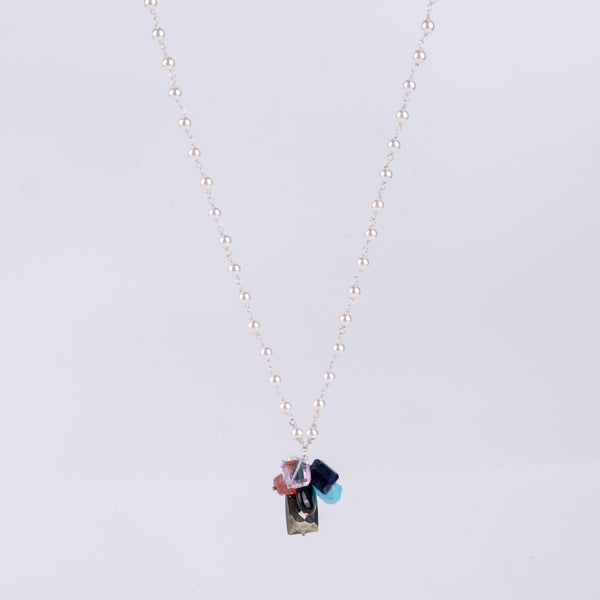 Angled side view of multicolour gemstone necklace showing layered design and silver craftsmanship