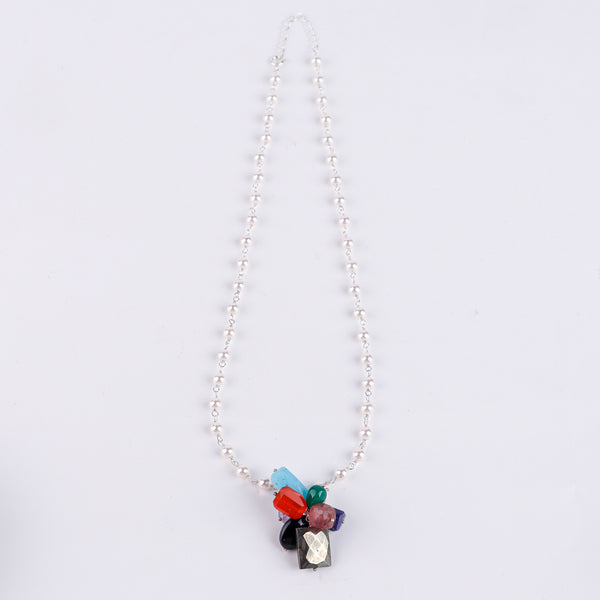 Macro detail of colorful gemstones and pearl Gantan on 92.5 sterling silver necklace