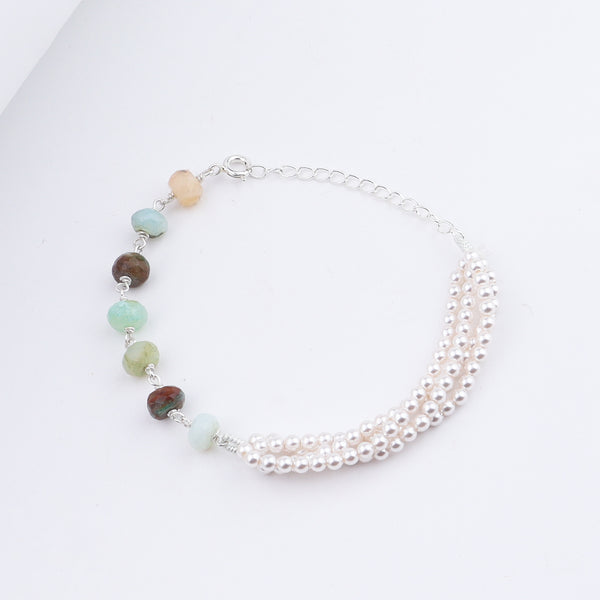 Close-up of pearl and gemstone bracelet