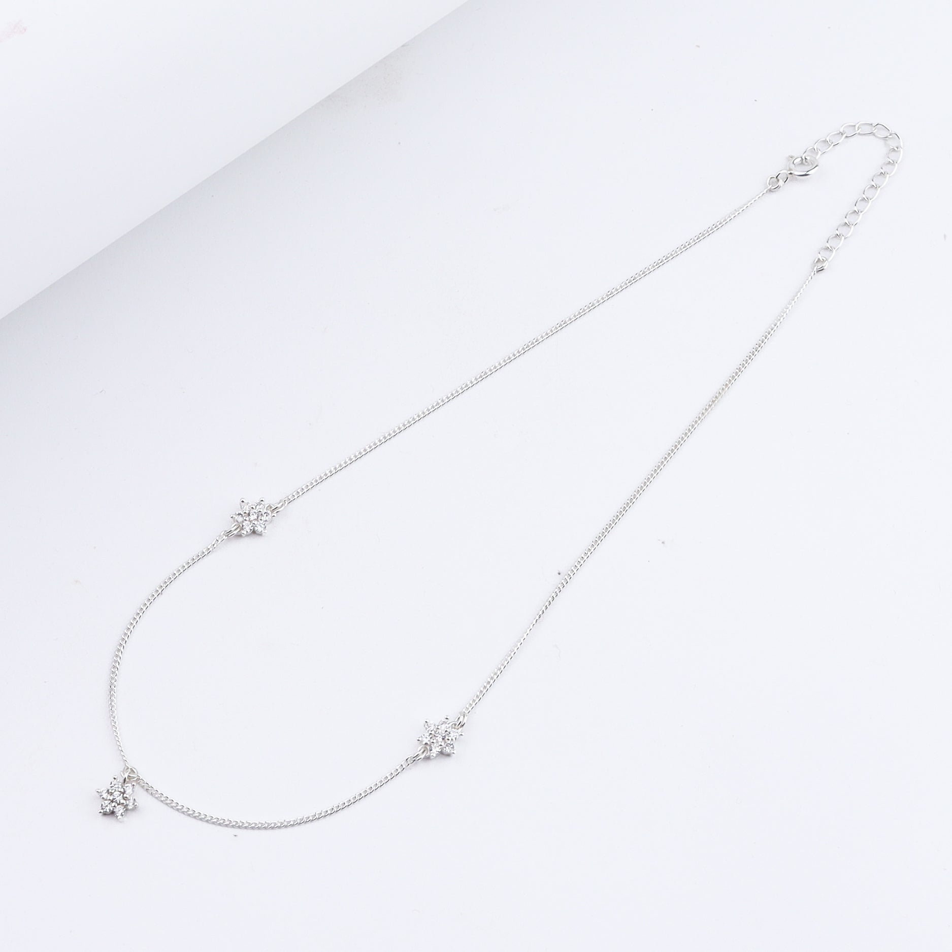 Silver CZ Flower Multi Motif Necklace – Small