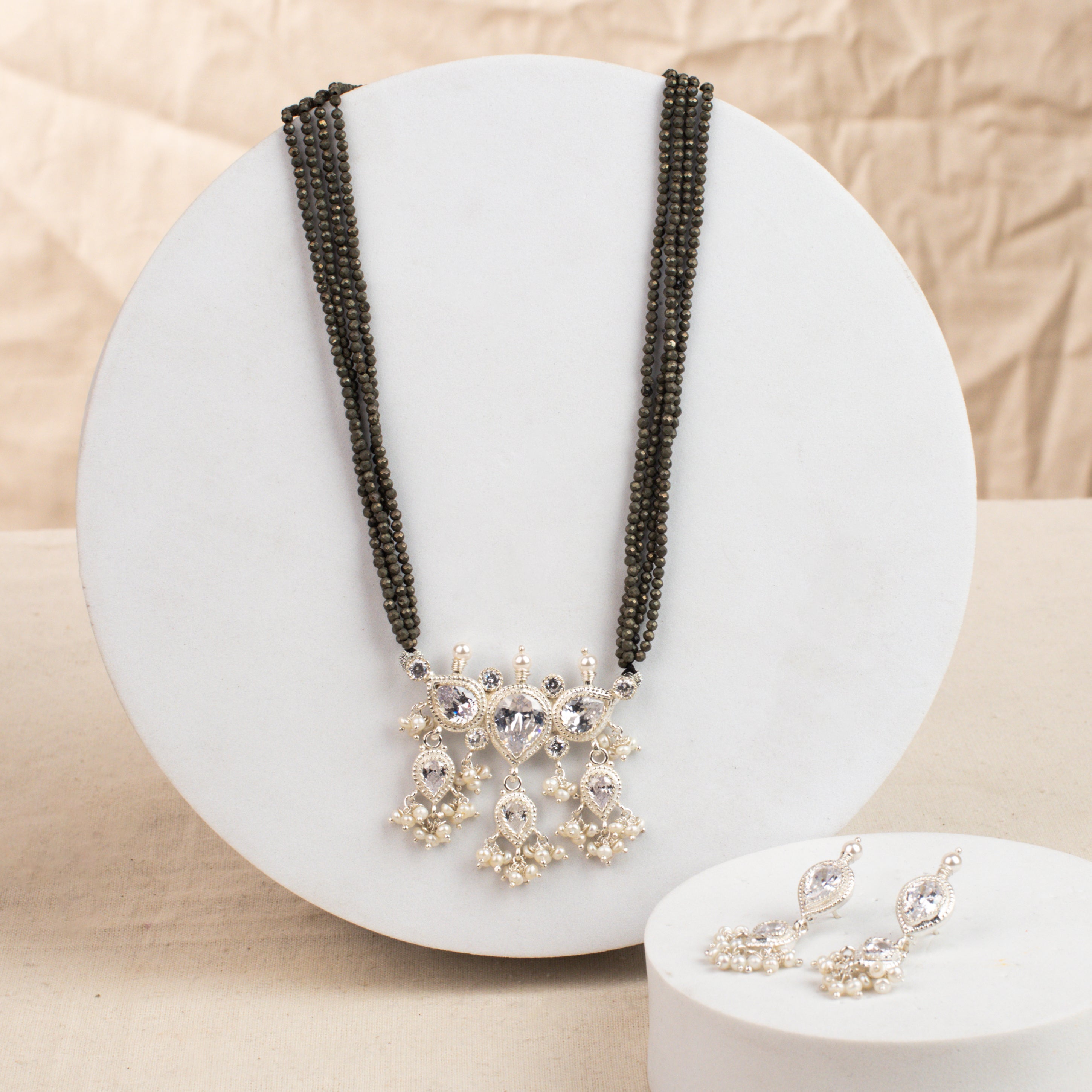 White CZ Tanmani Set with Pyrite Stones