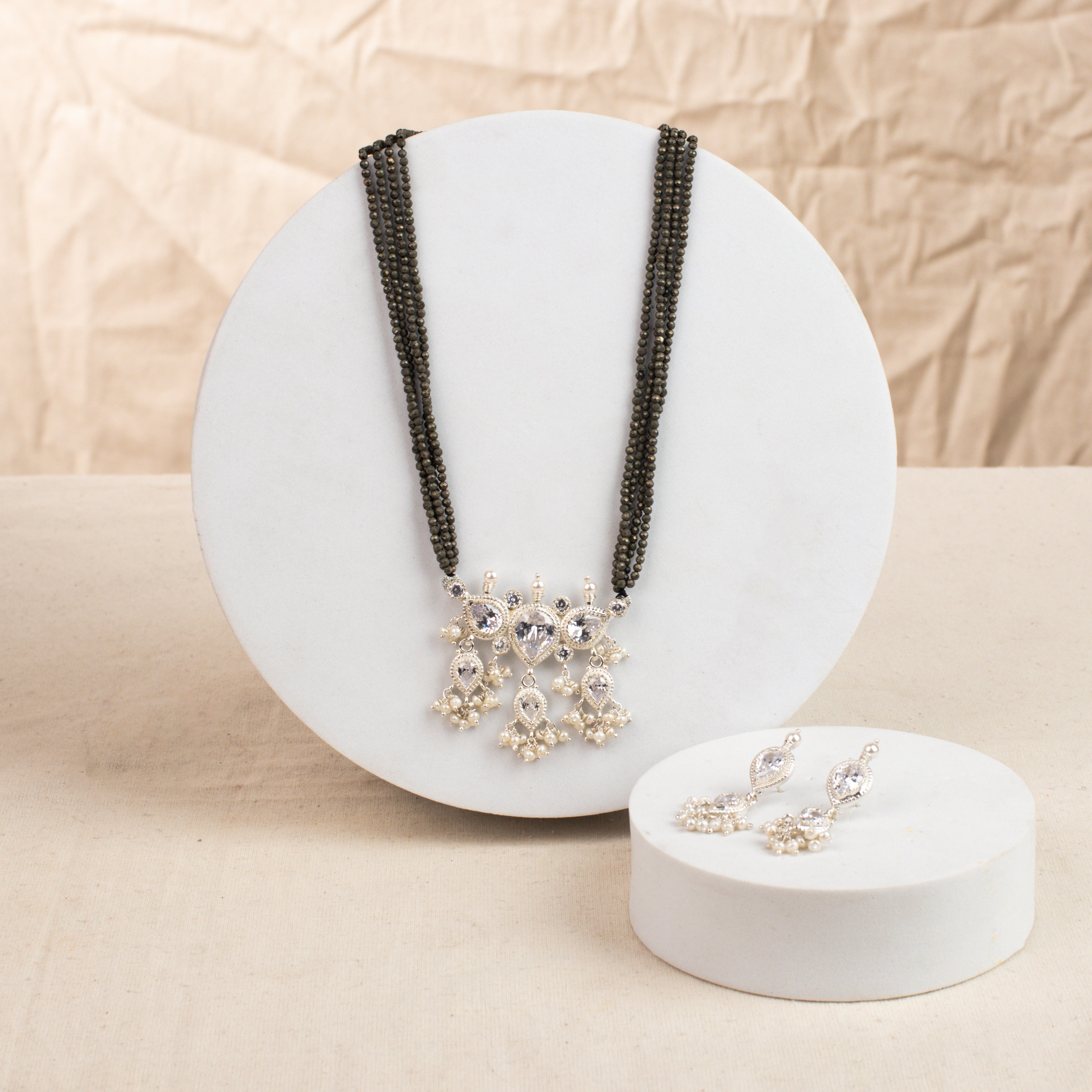 White CZ Tanmani Set with Pyrite Stones