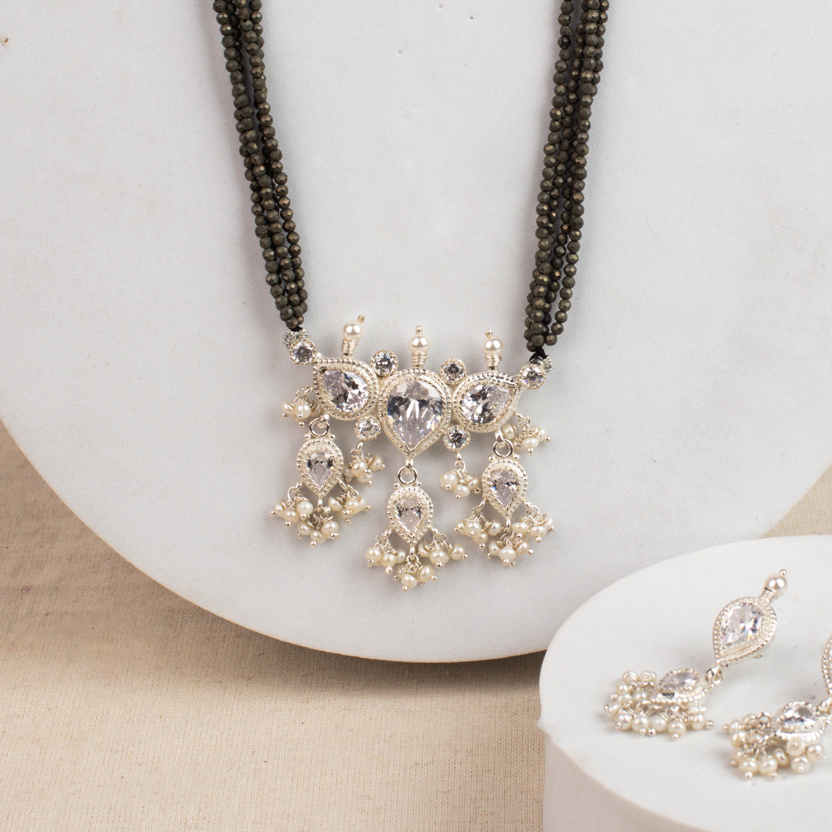 White CZ Tanmani Set with Pyrite Stones