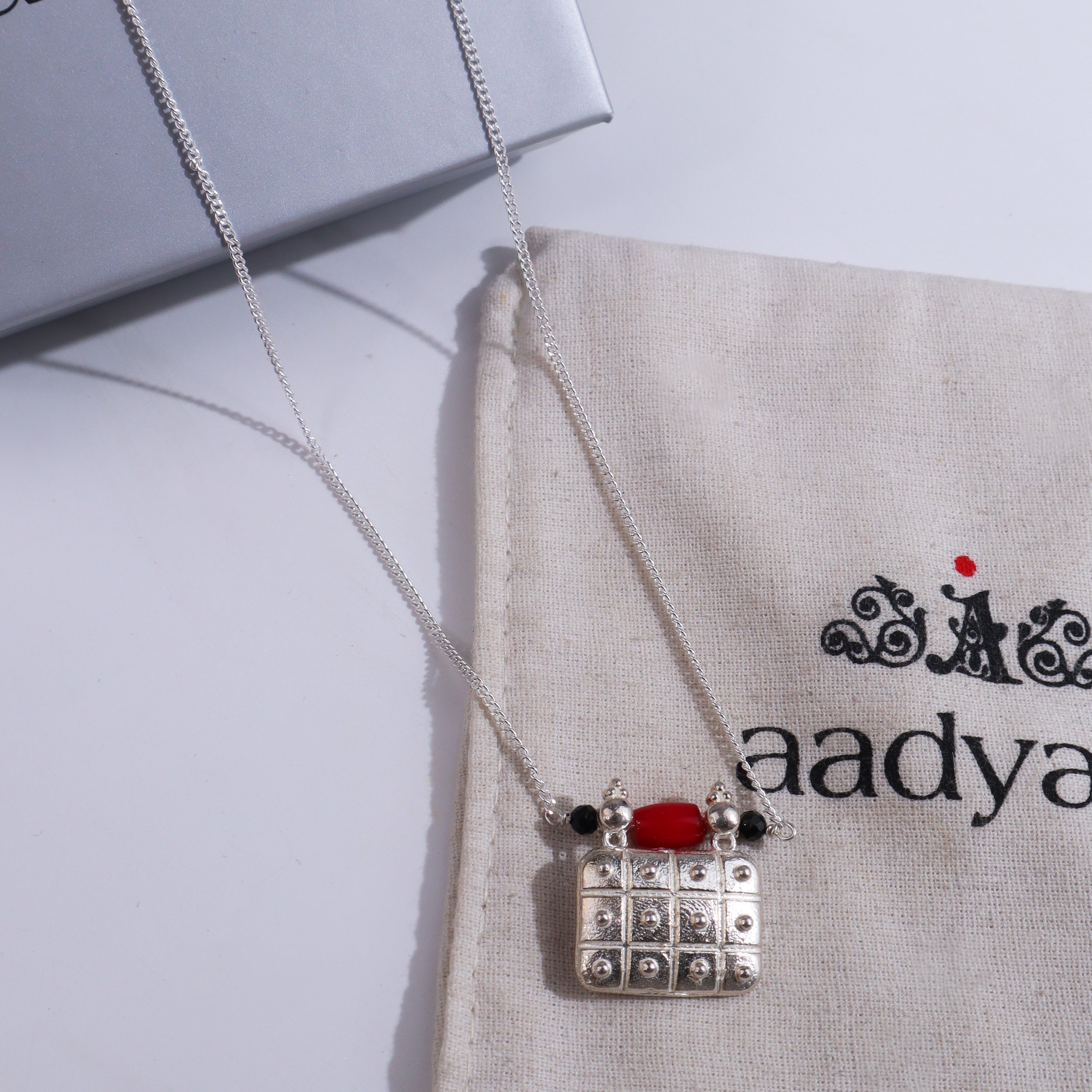 Silver chain with square pendant and beads