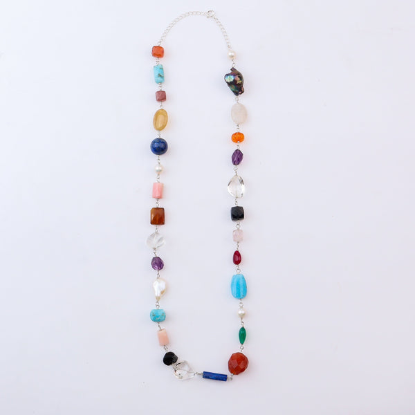 Multi-colored gemstone necklace with vibrant stones and silver chain