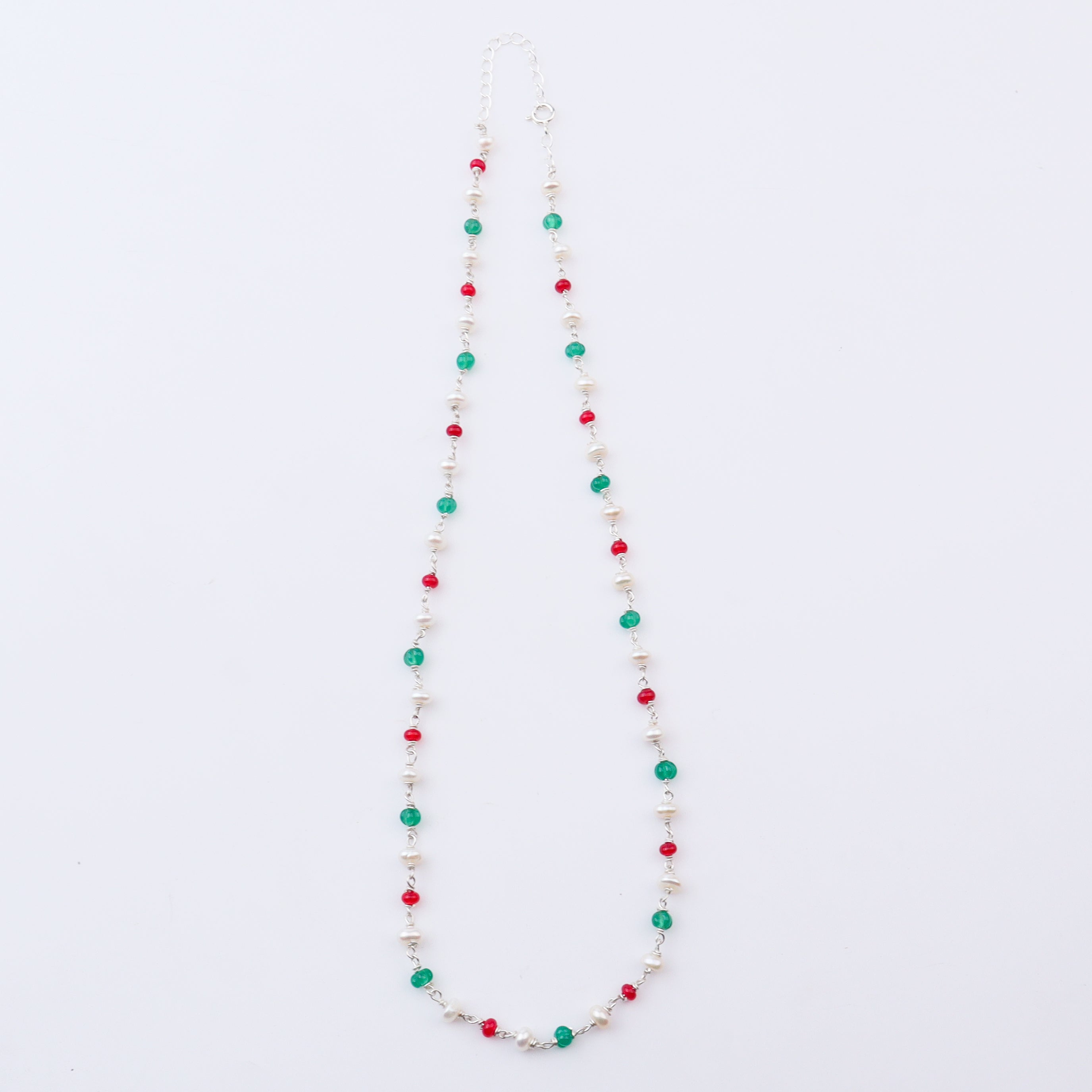 Colorful beaded necklace with pearls, red and green stones, silver chain, jewelry accessory