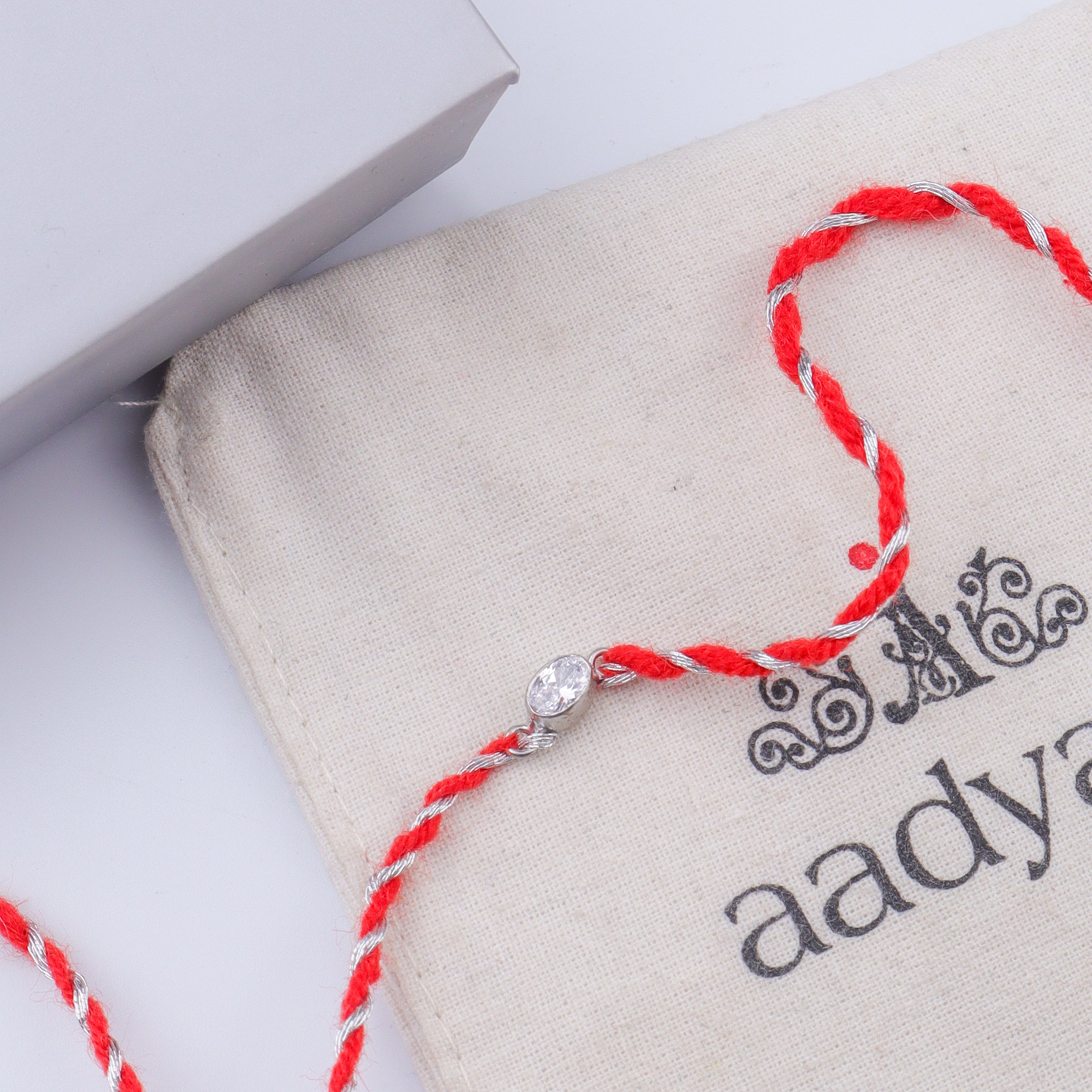 Oval Bezel Silver CZ Rakhi