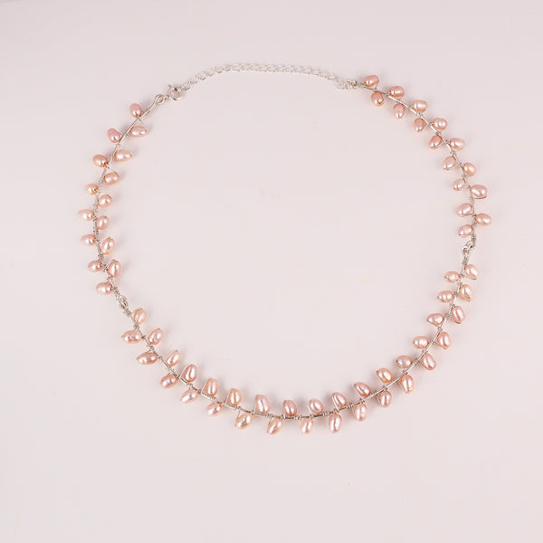Angled side view of fresh water pearl choker necklace showing smooth pearl alignment and shine