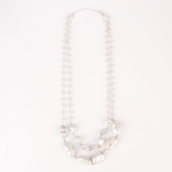 Angled side view of double layer fresh water pearl necklace showing layered drape and shine