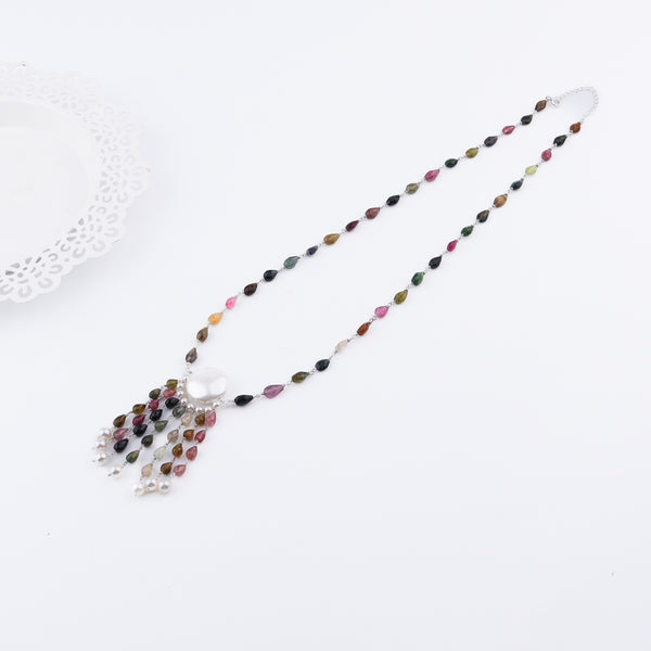 Colorful tourmaline and Swarovski pearl necklace on white background