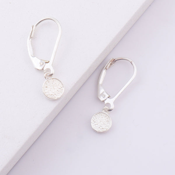 Silver earrings with textured round pendant