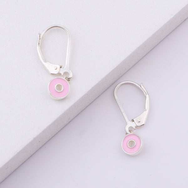White background with pink enamel donut earrings