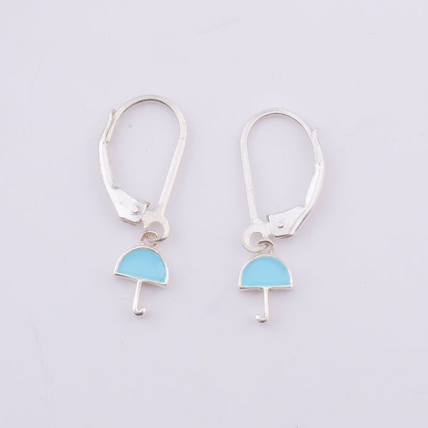 Silver enamel umbrella dangler earrings on model