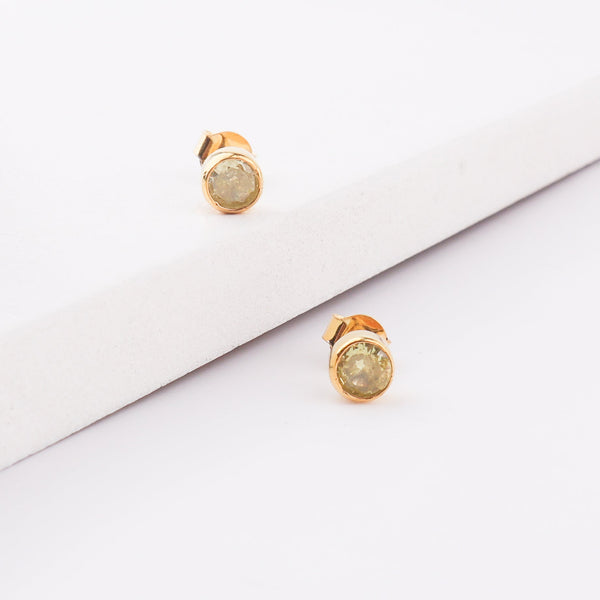Purple gemstone stud earring with gold setting