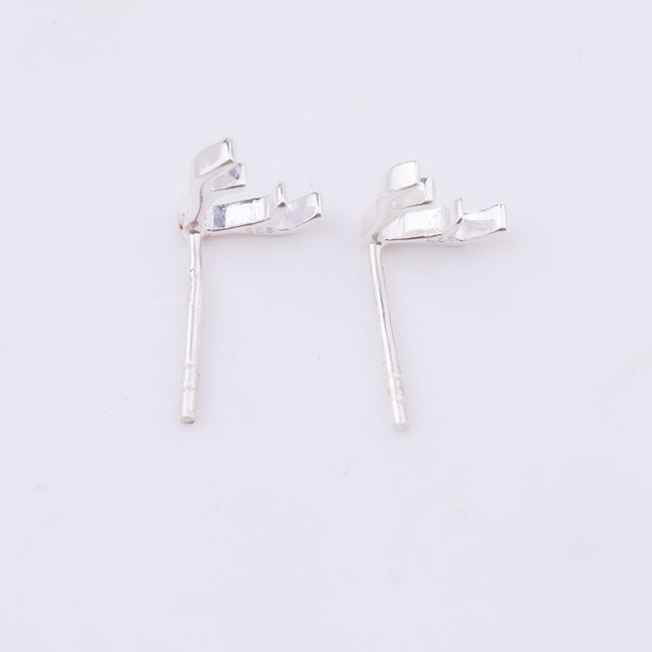 Silver deer horn studs earrings on white background