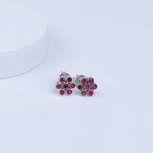 Silver Zircon Pink Kudi earrings with pink stones on white background