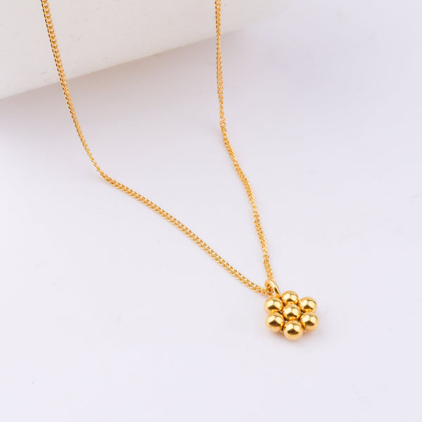 Gold chain necklace on white background