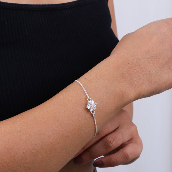 Silver flower bracelet on wrist