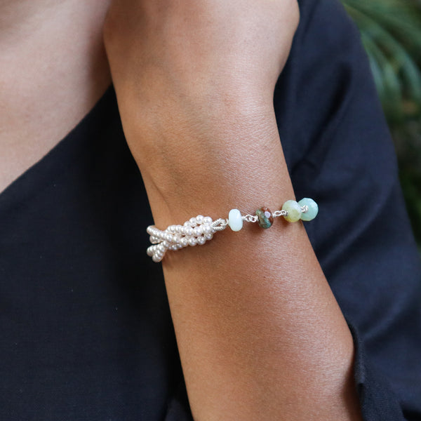 Pearl and gemstone bracelet on wrist