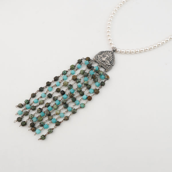 Detail shot of larimar, Swarovski pearl and unakite stone setting