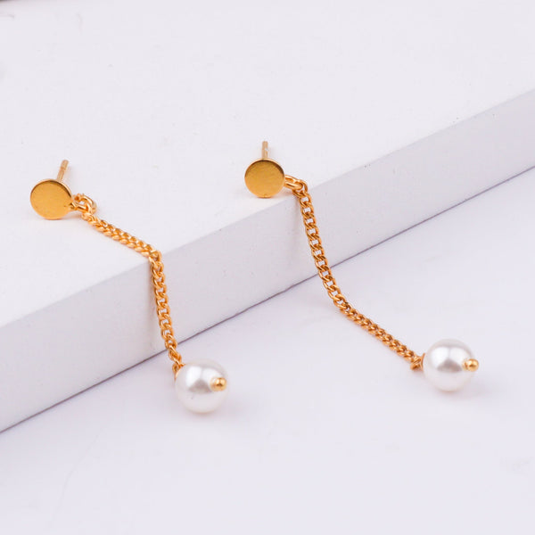 Back view of gold chain earrings with pearl drops