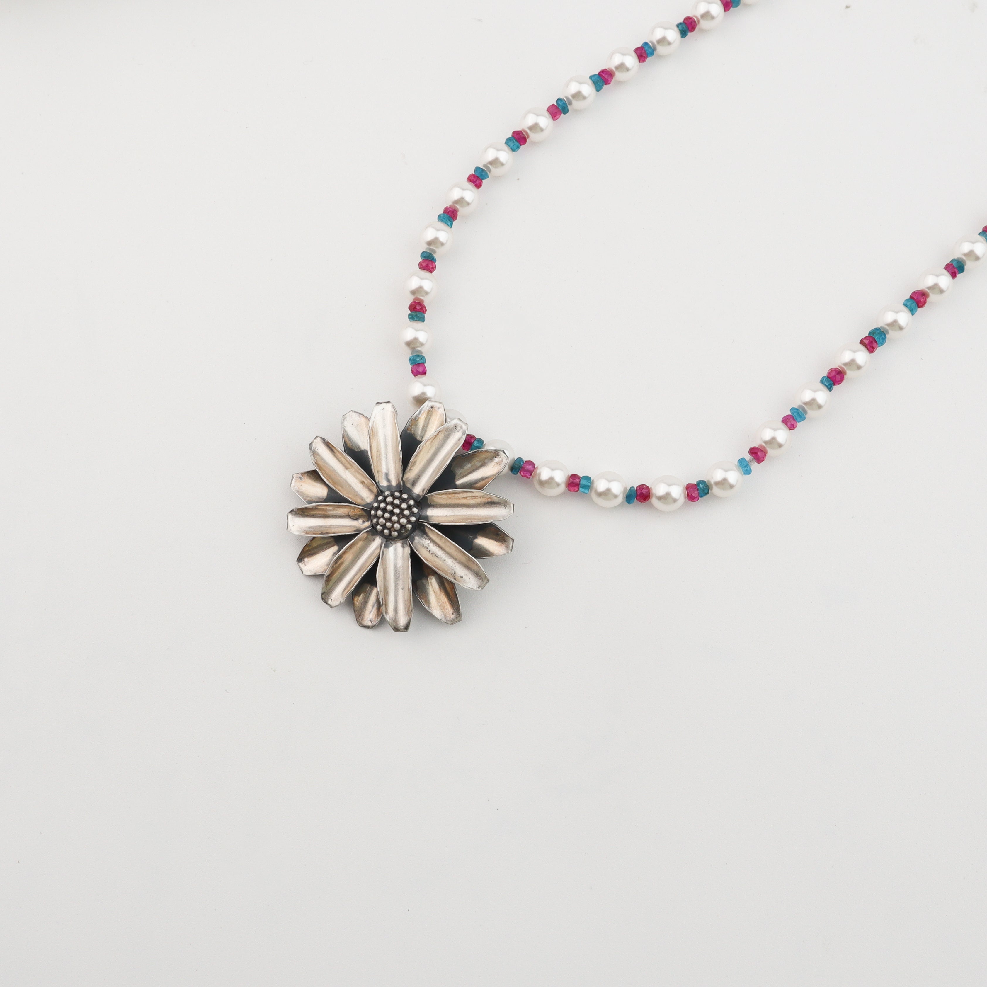 Silver Soorajmukhi Pendant Necklace with Pearls and Semiprecious Stones