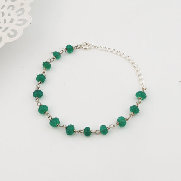 Angled side view of Silver Green Onyx Ganthan Bracelet
