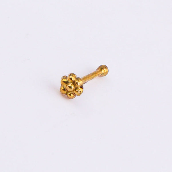 Gold nose pin with floral design on white background