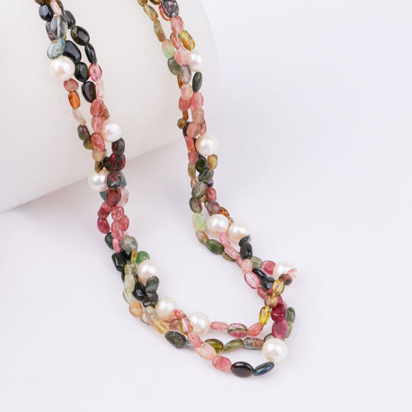 Jewelry necklace with multicolored stones and white pearls