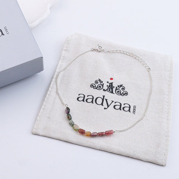 Rainbow gemstone anklet on wrist