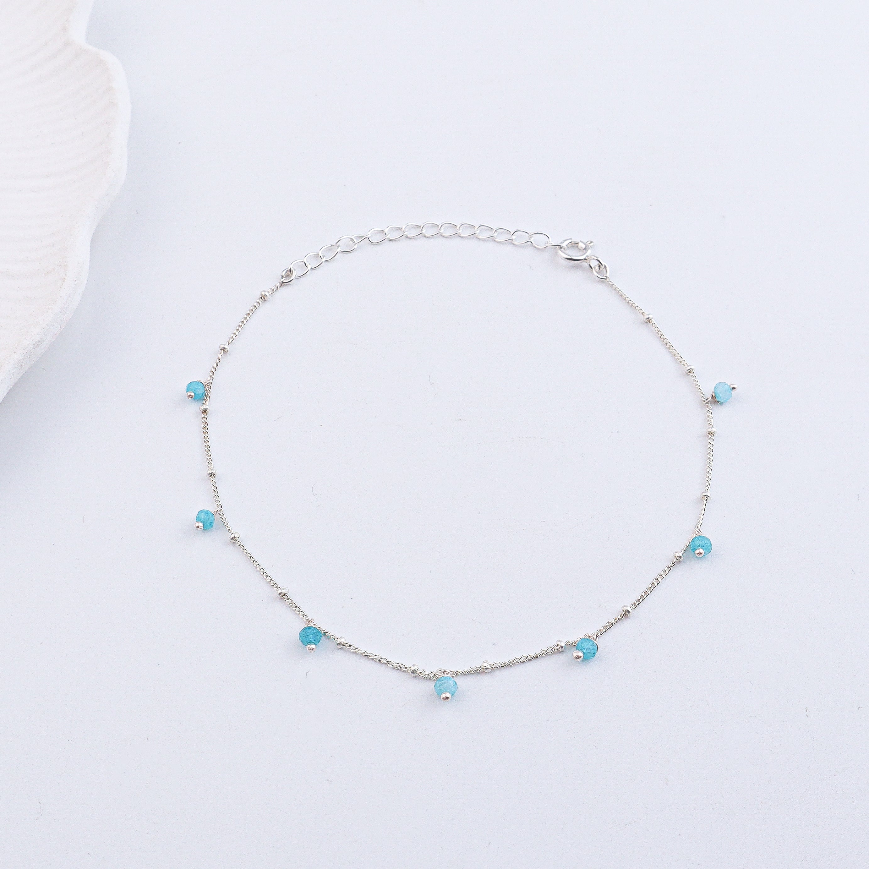 Silver anklet with blue gemstone beads