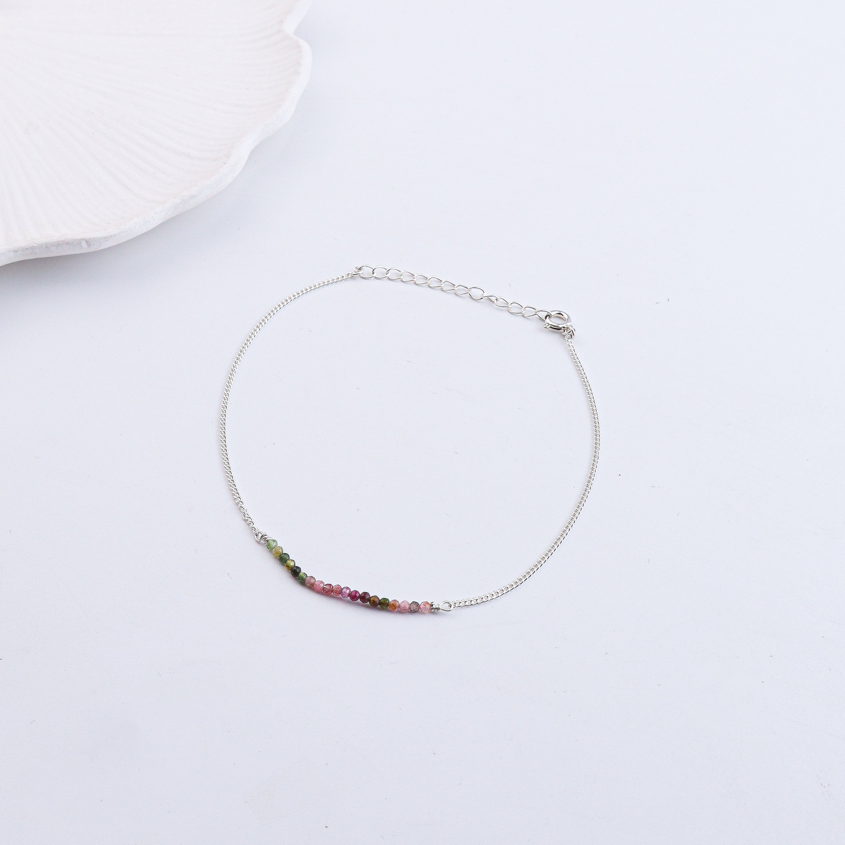 Silver anklet with rainbow-colored beads